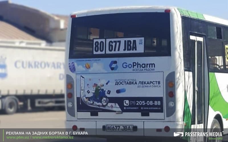 Реклама на задних бортах автобусов ISUZU в Бухаре